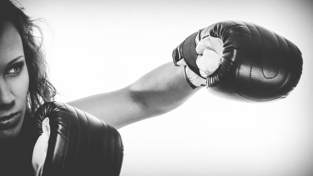 istock Boxer girl exercise with boxing gloves. 1291345472
