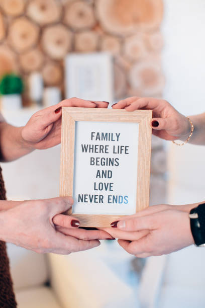 istock Tree lovely family members hold framed picture 1291345765