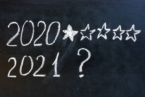 istock 2020 one star rate and 2021 question mark. Expectations concept. 1291354337