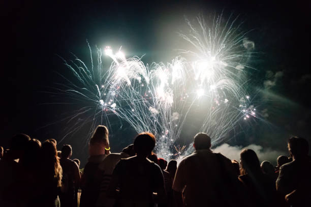 istock New year concept - cheering crowd and fireworks 1291355277