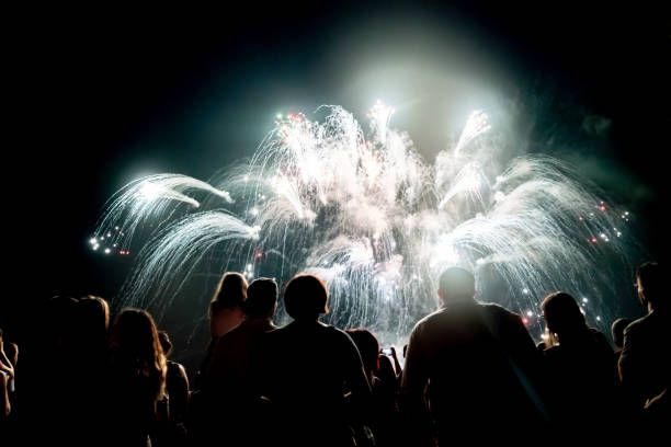 istock Crowd watching fireworks and celebrating new year eve 1291355279