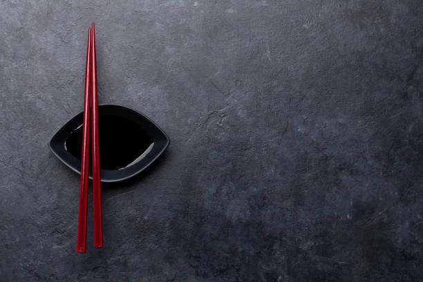 istock Stone table and chopsticks for your sushi and maki 1291355953