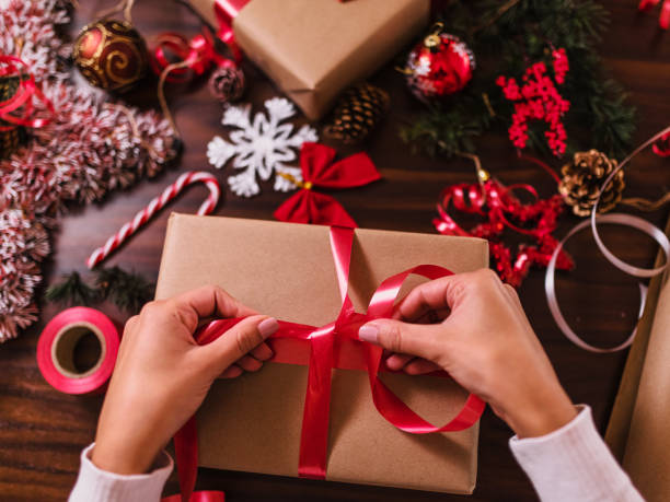 istock Wrapping Christmas gifts 1291357479