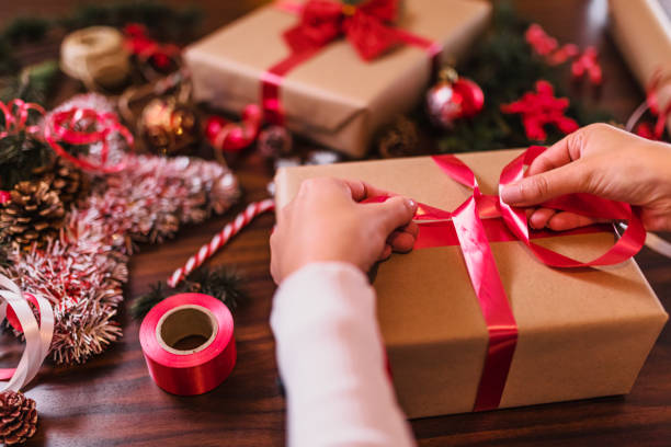 istock Wrapping Christmas gifts 1291358053