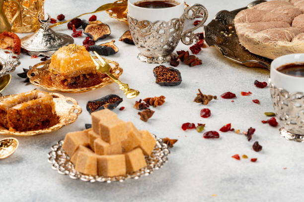istock Cup of coffee and turkish pastries on dark surface 1291359352
