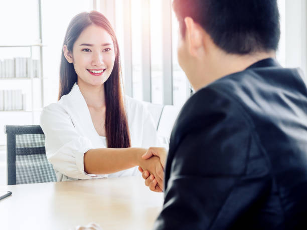 istock Business people shaking hands at meeting in office with successful. 1291360205