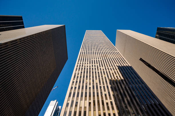 istock Low angle view of modern skyscrapers in Midtown Manhattan 1291360387