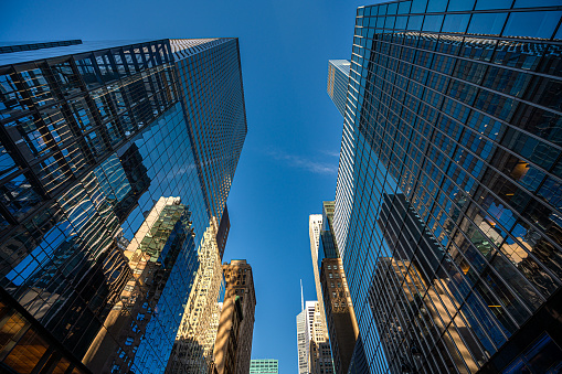 Futuristic skyscrapers in Midtown Manhattan on a sunny day.