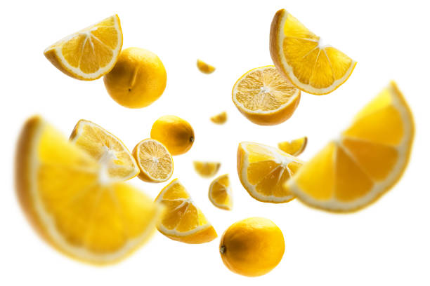 Yellow lemons levitate on a white background stock photo