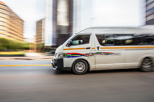 Taxi bus travelling in Johannesburg city, Johannesburg is also known as Jozi, Jo'burg or eGoli, is the largest city in South Africa.