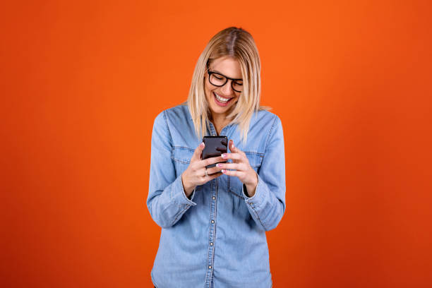 istock Happy young girl using smart phone 1291362671