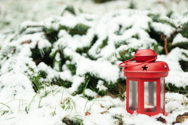 istock Red lantern with candle outdoor on snow, space for text 1291363816