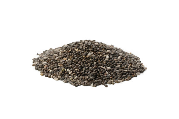 istock Heap of chia seed isolated on white background 1291364836