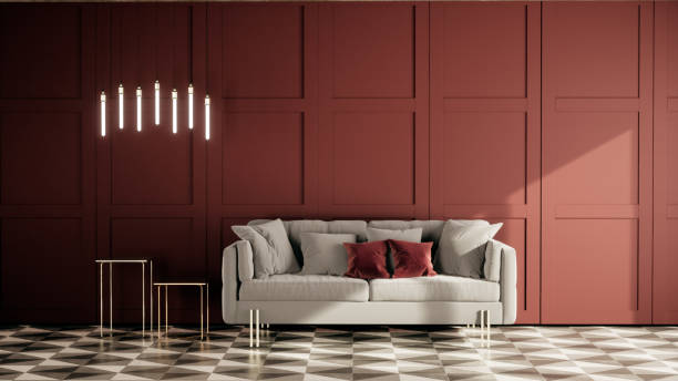 istock 3d rendering living room interior with sofa and red classic wall panel decoration with design lamp and side table. 1291365136