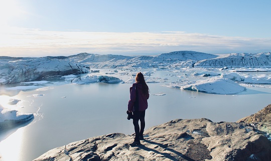 Woman watching Svinafellsjokull Glacier in Iceland
