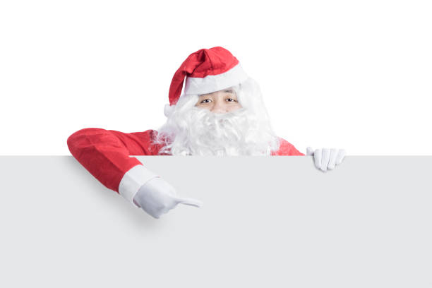 istock Asian man in Santa costume showing empty board 1291366573