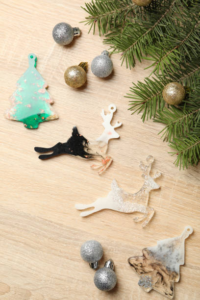 istock Pine branches and Christmas baubles on wooden background 1291366601