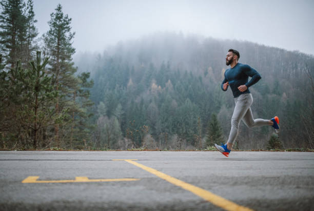 istock Male athlete running outdoor. 1291367455