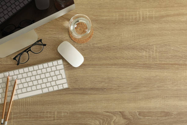 istock Concept of workplace with modern desktop computer on wooden background 1291367877