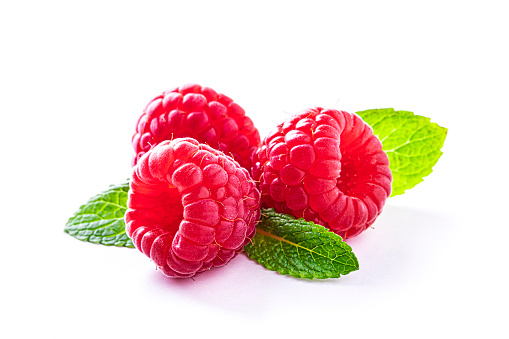 Group of fresh raspberries isolated on white background