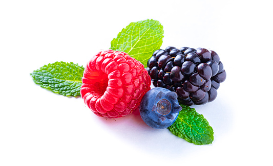 Pile in a group of blackberry berries ripe on white background closeup for healthy eating