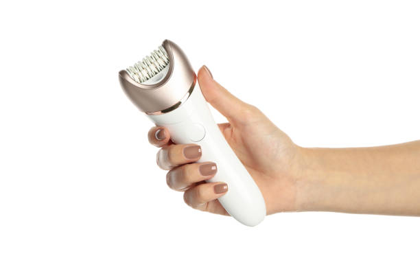 istock Female hand hold epilator, isolated on white background 1291369023