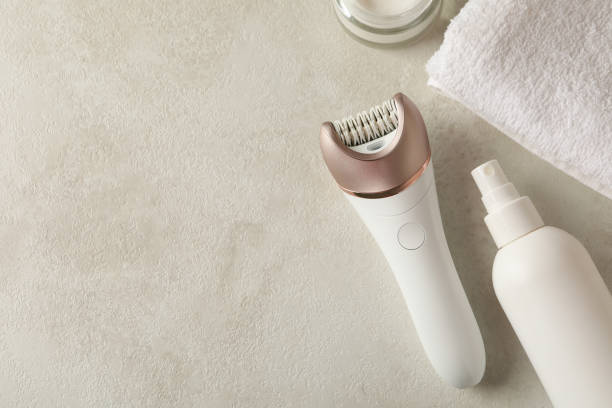 istock Concept of skincare with epilator on white table 1291369091
