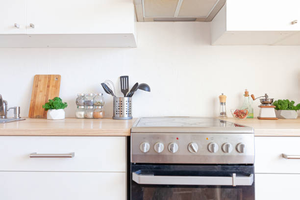 istock Scandinavian classic minimalistic kitchen with white and wooden details. Modern white kitchen clean contemporary style interior design 1291370264