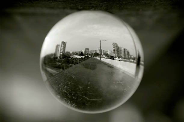 istock Street view through a lens ball. 1291371156