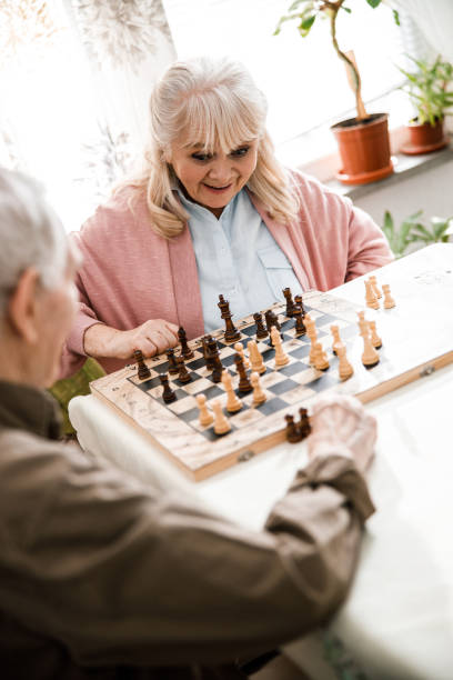 Woman looking at the chessboard with wonder
