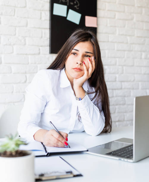 istock Sad or depressed brunette woman looking away 1291375471
