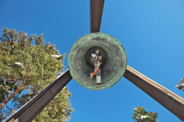 In the Alpes-de-Haute-Provence in Pra-Loup, mountain resort of the Ubaye, the underside of the bell tower built in 1981.\nThis bell tower is erected outside the chapel of St. Francis of Assisi inaugurated in 1969.\nI liked the orange knot!