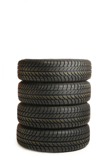 istock Four black tires isolated on white background 1291376850