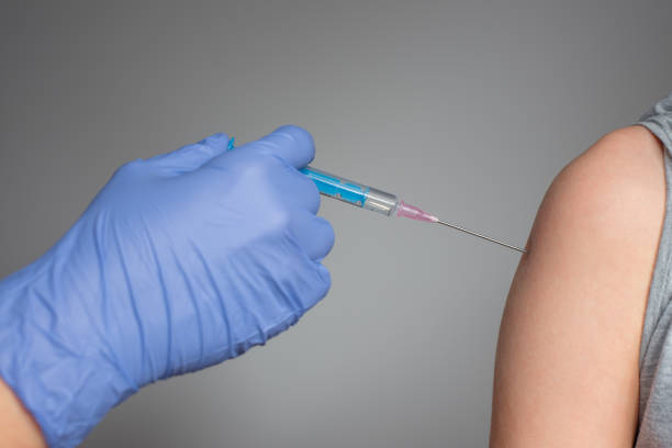 istock Doctor is preparing to vaccinate the patient 1291379017
