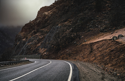 Misty road through the mountains