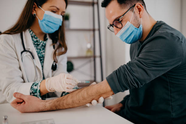 istock doctor vaccinates patients with the vaccine 1291381371