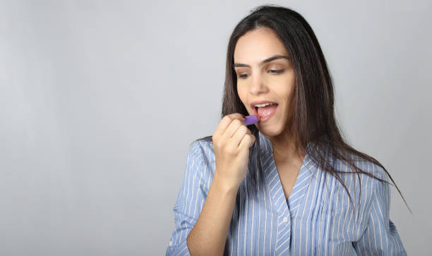 istock Business girl  using lipstick 1291382714