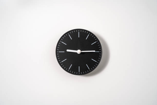 istock close up of an office clock on white background with clipping path 1291388834