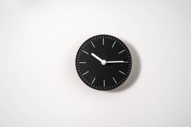 istock close up of an office clock on white background with clipping path 1291388938
