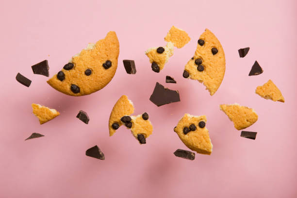 istock Delicious cookies with chocolate chips on a colored background 1291389636