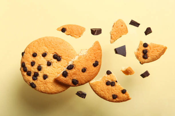 istock Delicious cookies with chocolate chips on a colored background 1291390397