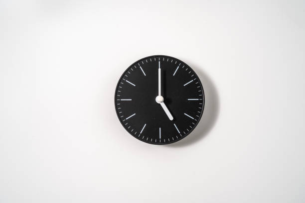 istock close up of an office clock on white background with clipping path 1291391093