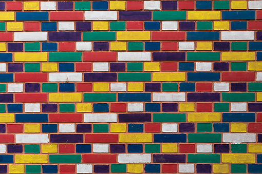 Colorful brick wall, closeup view.