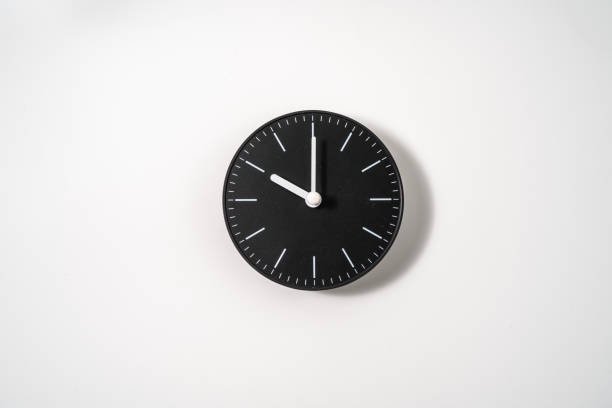 istock close up of an office clock on white background with clipping path 1291392722