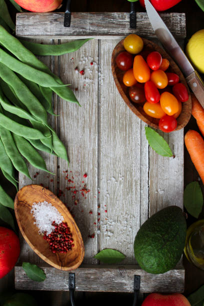 istock Vegetables and fruits on wooden background. 1291392925