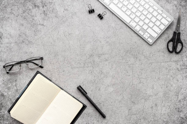 istock Office workplace flat lay background. Keyboard and office supplies top view 1291394161