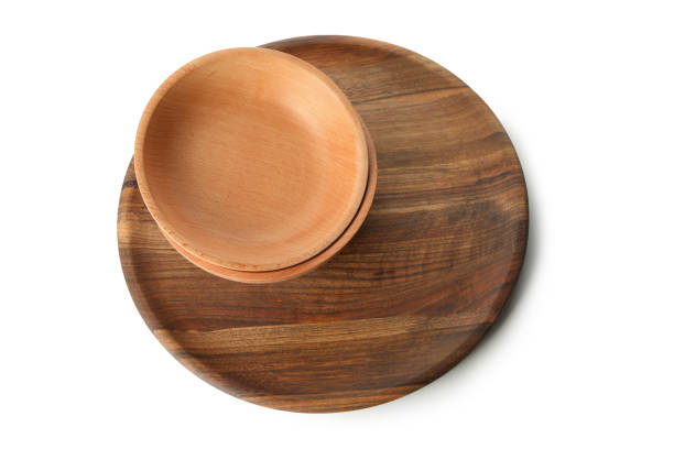 istock Wooden board with bowl isolated on white background 1291396298