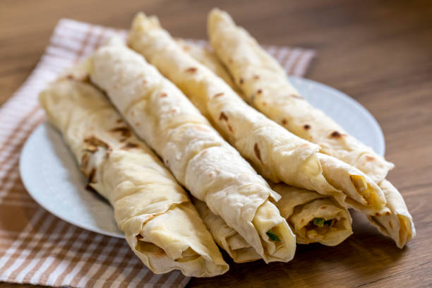 istock Traditional, local Turkish food; cheese pastry wrap (Turkish name; Sikma) 1291400984