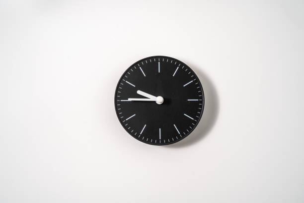 istock close up of an office clock on white background with clipping path 1291401981