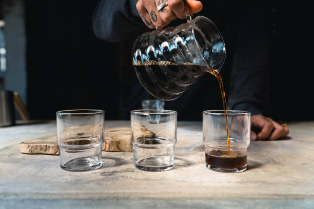 istock Drip coffee, barista pouring water on coffee ground with filter,brewing coffee 1291402116